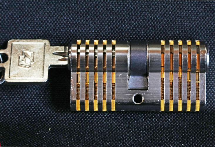 Close up of internal workings of lock, advertising for locksmith from Market Drayton