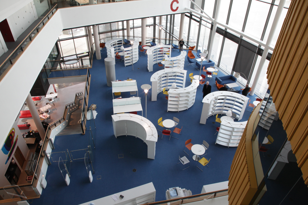 I was asked to take photos for the University of Wales, Newport, of their new City Centre Campus in the run-up to its' opening and in the opening week.  Here is the library area a couple of weekes before opening, ready for the books to start being loaded onto the shelves.