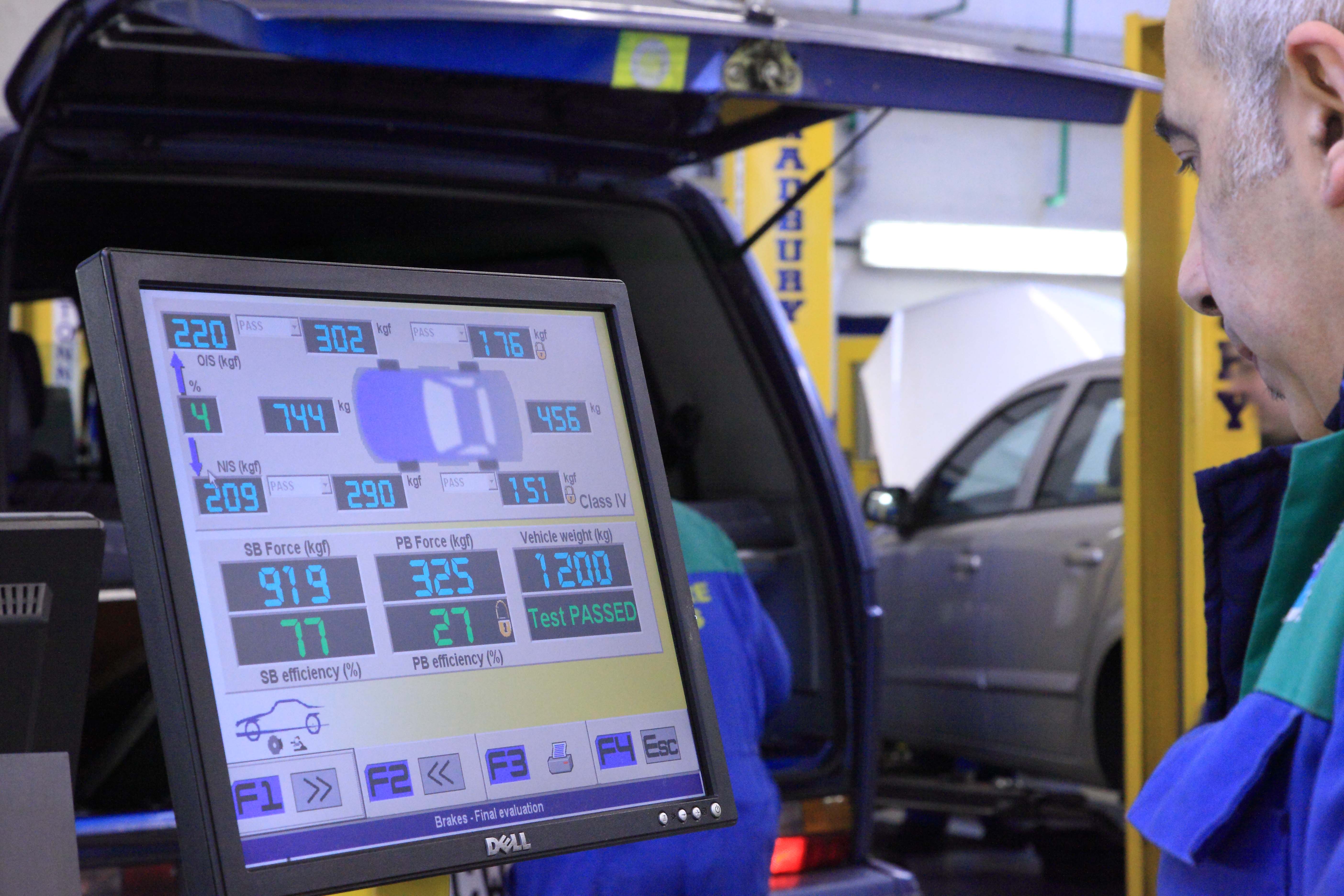 Inside Delamere Motors MOT section, showing customer's car passing MOT Test