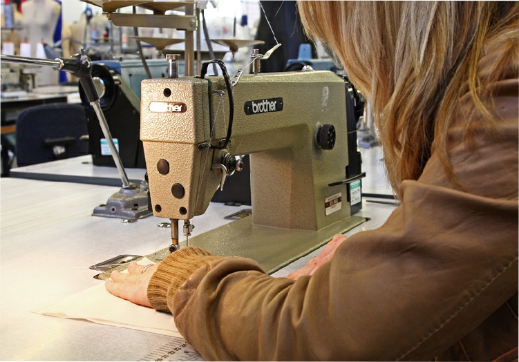 Photograph of trainee using Brother sewing machine at Carmarthen College. Part of an educational series taken for Skillset