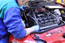 Company Advertising, Delamere Motors, Telford, Shropshire, showing their one of their skilled mechanics chaning a cam belt.