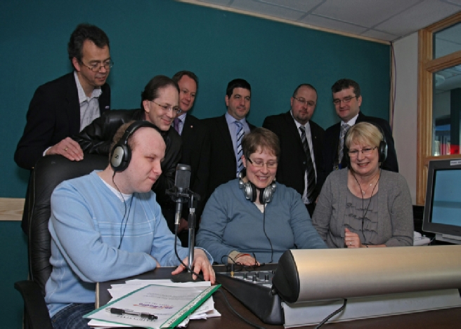 Some of Able Radio's broadcast team with the station's sponsors