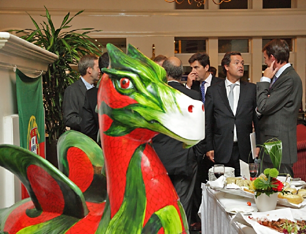 Portuguese Diplomats and Golf Officials, under the watchful eye of a Newport Dragon.  Photograph taken in Newport for Portuguese Government bid for a future Ryder Cup event.