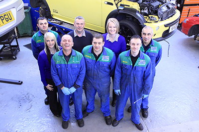 Group photo taken for a car repair business